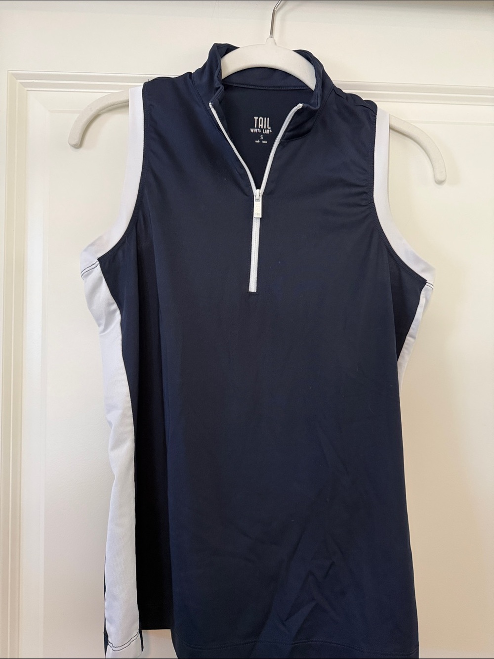 TAIL navy and white sleeveless zip golf top